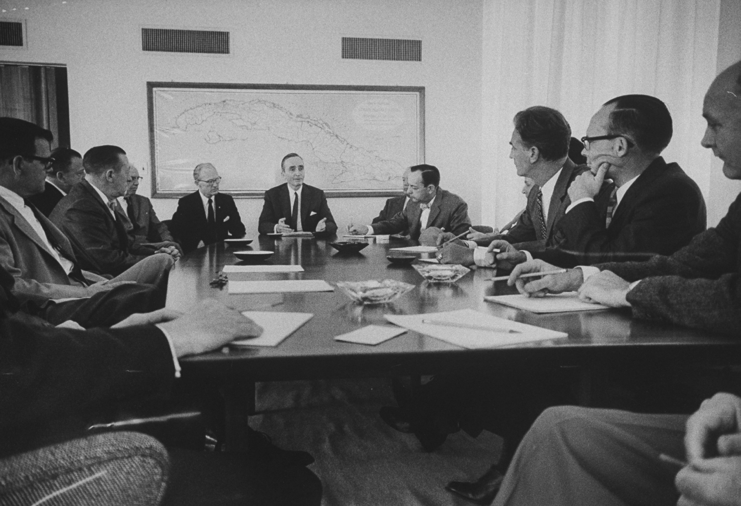 PHOTO: Ambassador Philip W. Bonsal meets with his staff at the U.S. Embassy in Havana, Cuba in 1960. 