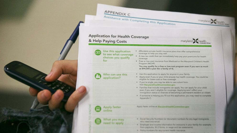 Health navigator Rebecca Wener holds a Maryland Health Connection health insurance marketplace written application at a Community Clinic Inc. health center in Takoma Park, Maryland, U.S., on Oct. 1, 2013. 