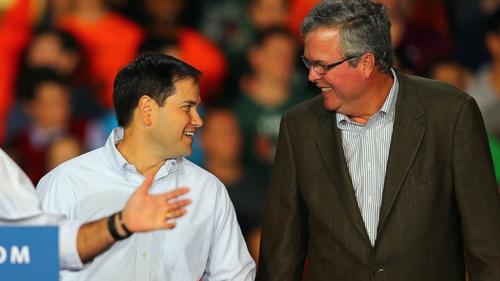 Marco Rubio and Jeb Bush attend a campaign rally for Mitt Romney at the University of Miami on Oct. 31, 2012 in Miami.