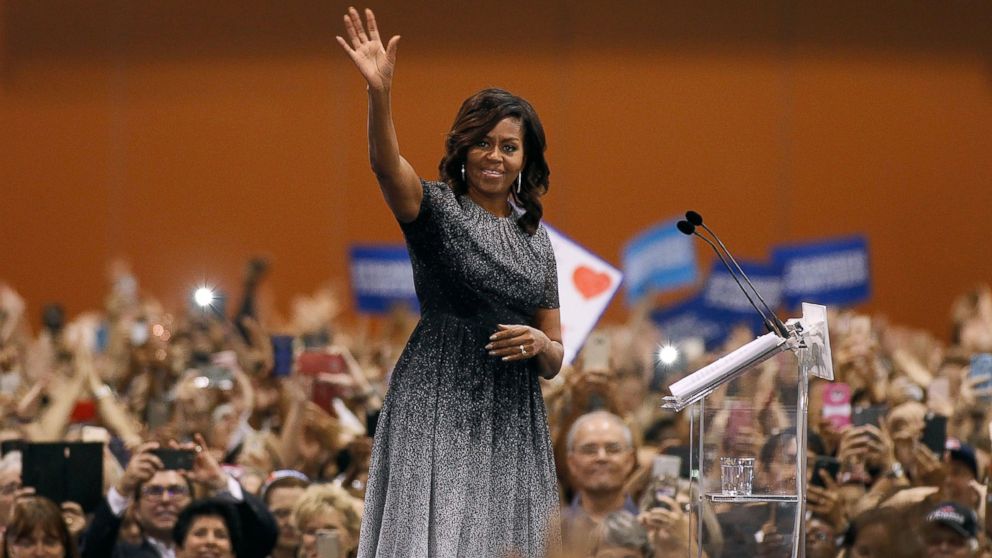 Michelle Obama waves to the crowd as she speaks at an Arizona Democratic Party Early Vote rally in support of Democratic presidential nominee Hillary Clinton, Oct. 20, 2016, in Phoenix, Arizona. 
