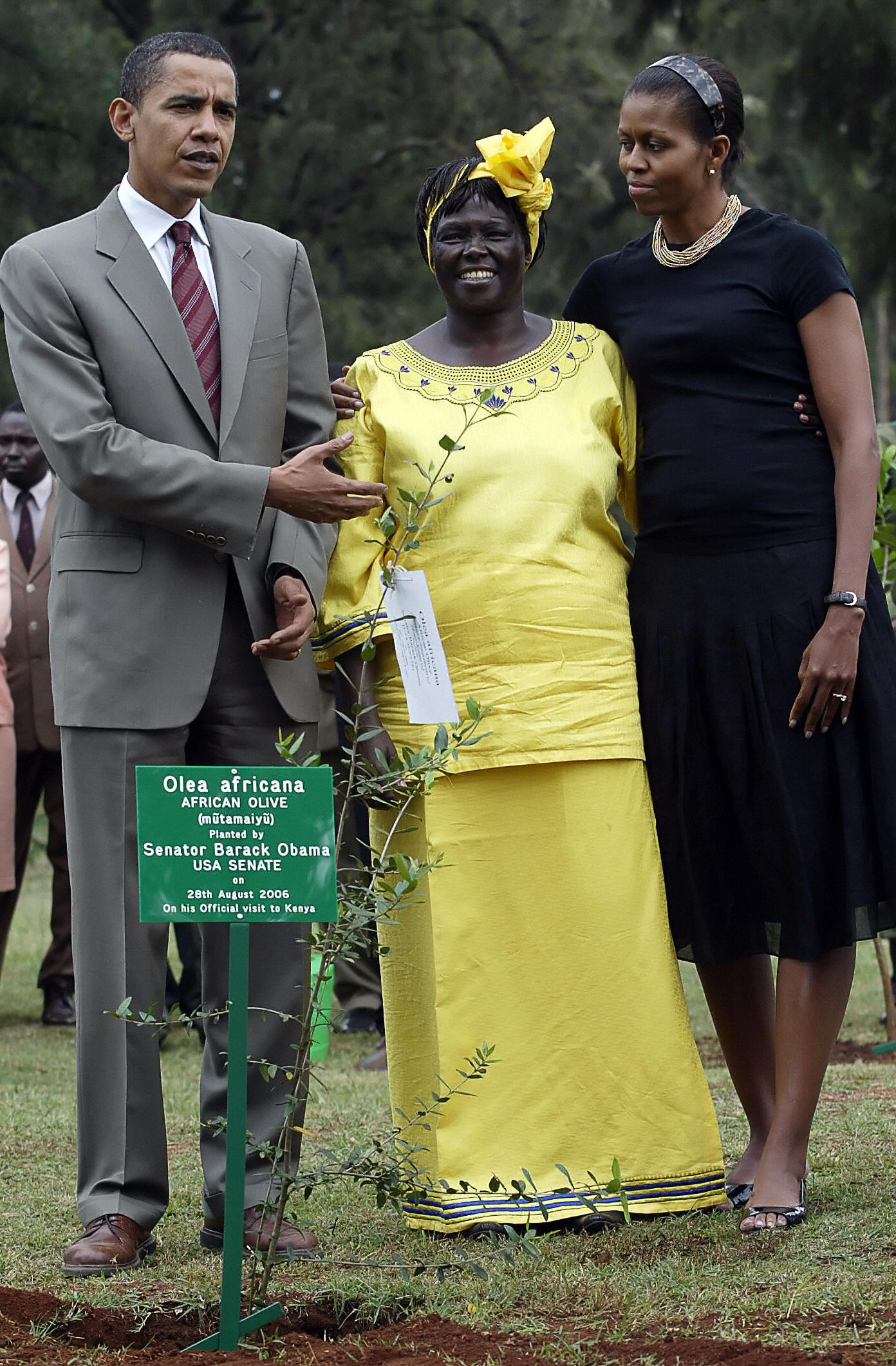 PHOTO: Barack Obama gestures while posing with his wife Michelle and Wangari Mathai at a tree planting ceremony in Nairobi, Kenya, 28 Aug. 2006. 