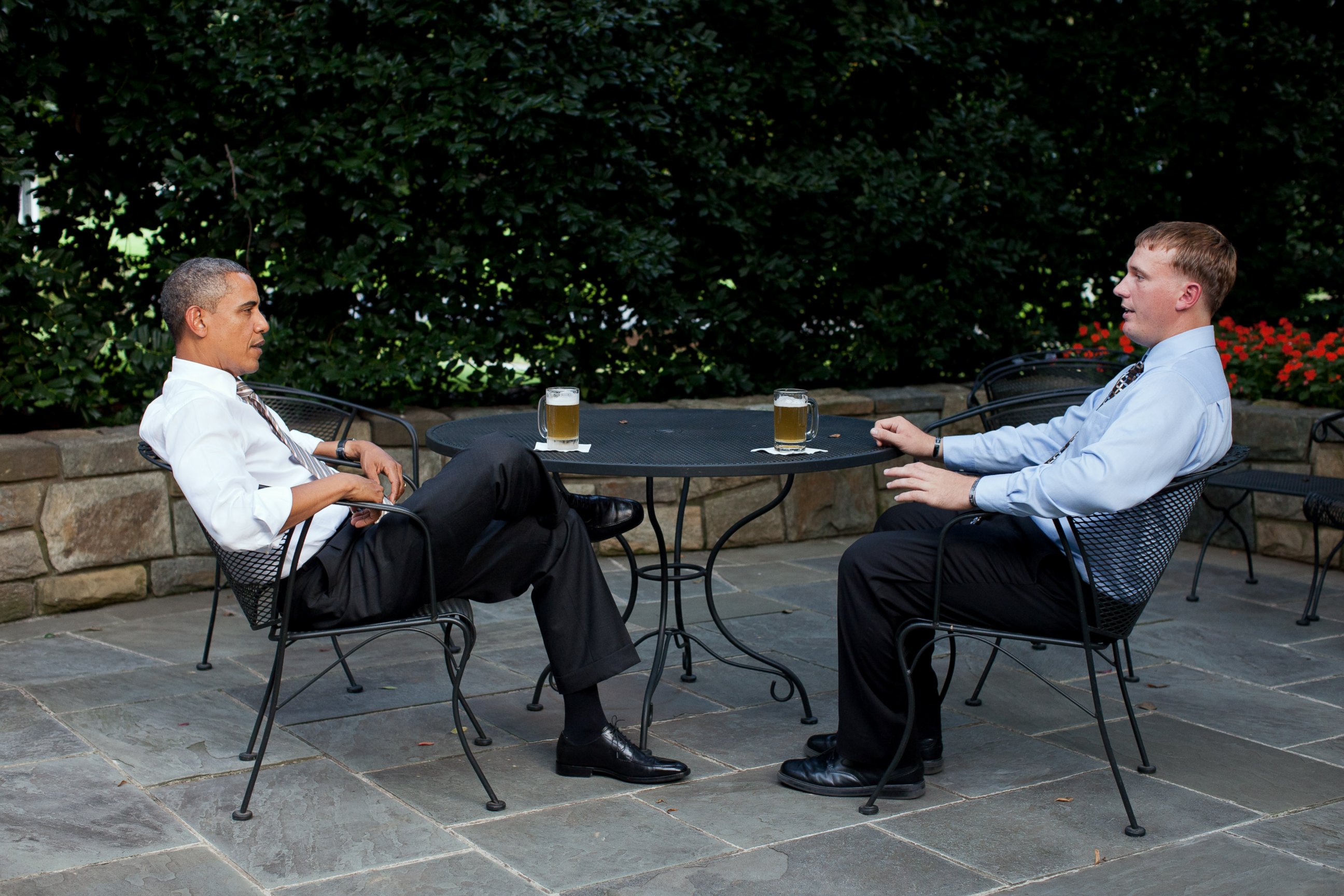 PHOTO: In this handout provided by the White House, U.S. President Barack Obama (L) enjoys a beer with Dakota Meyer on the patio outside of the Oval Office, Sept. 14, 2011 in Washington. 