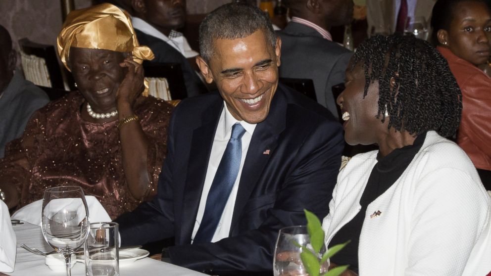 US President Barack Obama sits alongside his step-grandmother, Mama Sarah (L) and half-sister Auma Obama (R), during a gathering of family at his hotel in Nairobi, Kenya, July 24, 2015.      