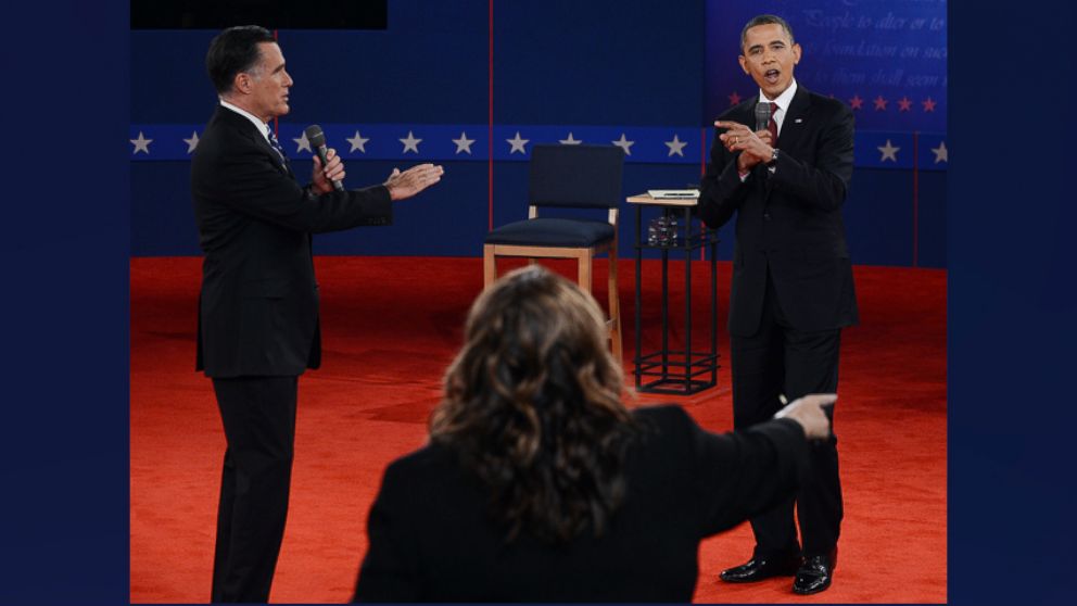 CNN's Candy Crowley (C) conducts the second presidential debate with Mitt Romney and Barack Obama at Hofstra University in Hempstead, New York, October 16, 2012. 