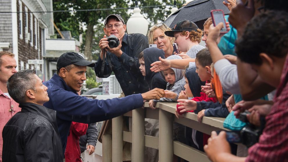 President Barack Obama shakes hands with people as he arrives at Nancy's restaurant in Oak Bluffs, Mass. on August 13, 2013.