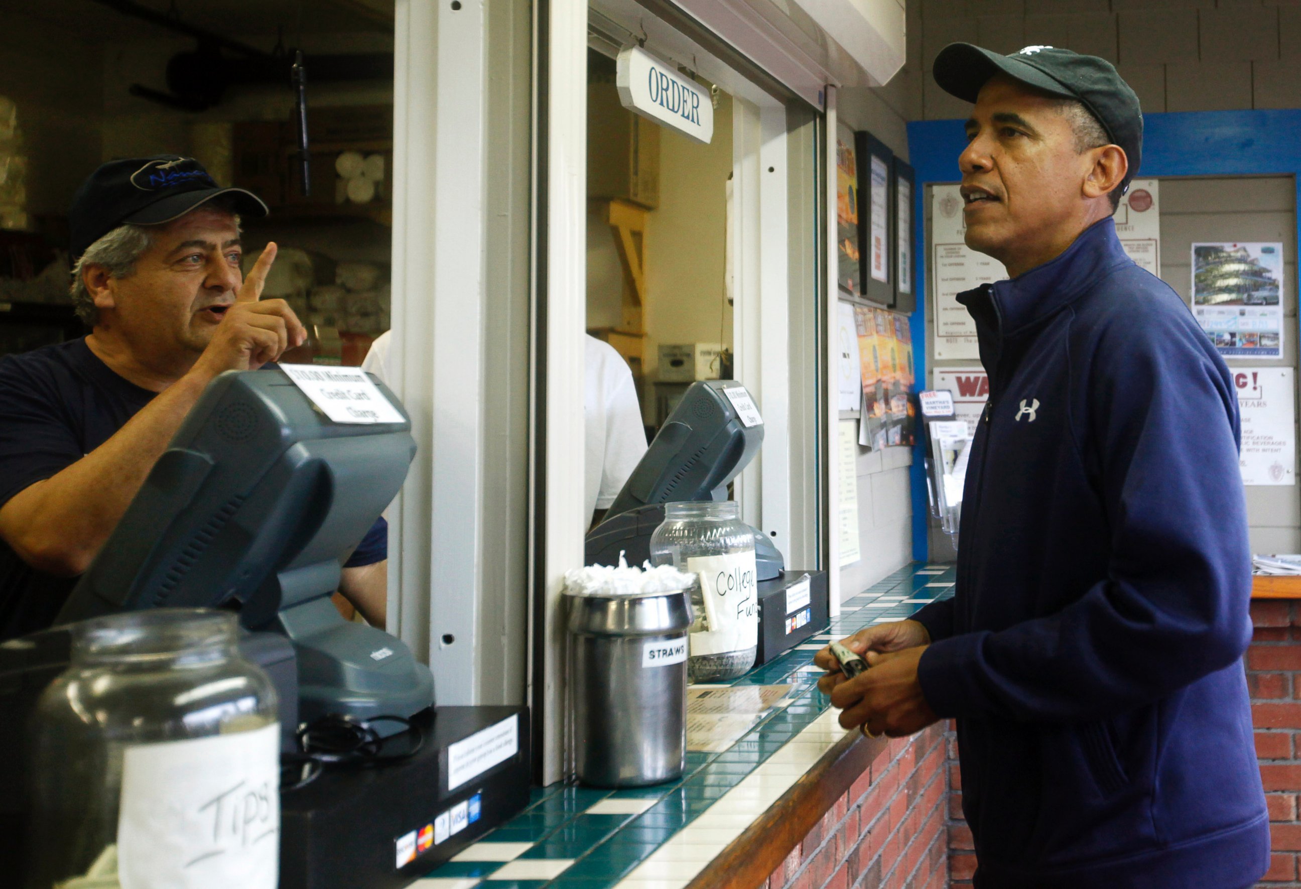 PHOTO: President Barack Obama places an order at Nancy's Restaurant on August 13, 2013 in Oak Bluffs, Mass.
