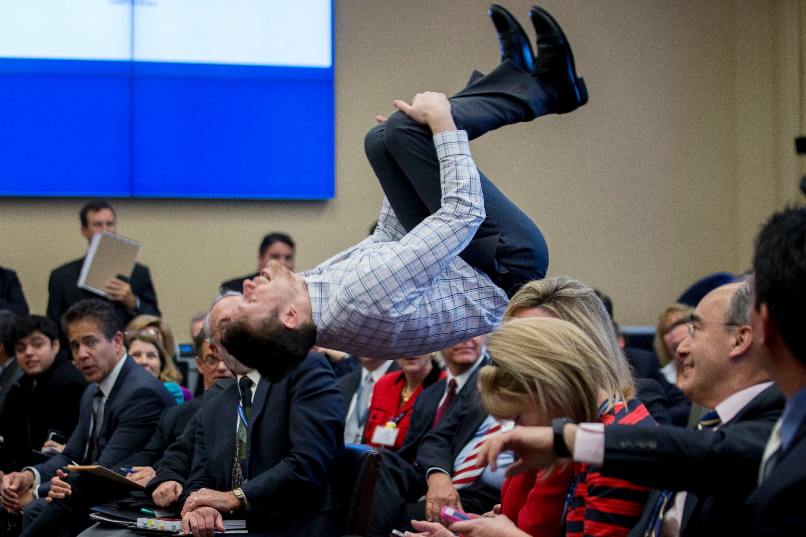 PHOTO: Representative-elect Gwen Graham supporter Paul Woodward performs a back flip during a member-elect room lottery draw on Capitol Hill in Washington, D.C. on Nov. 19, 2014.