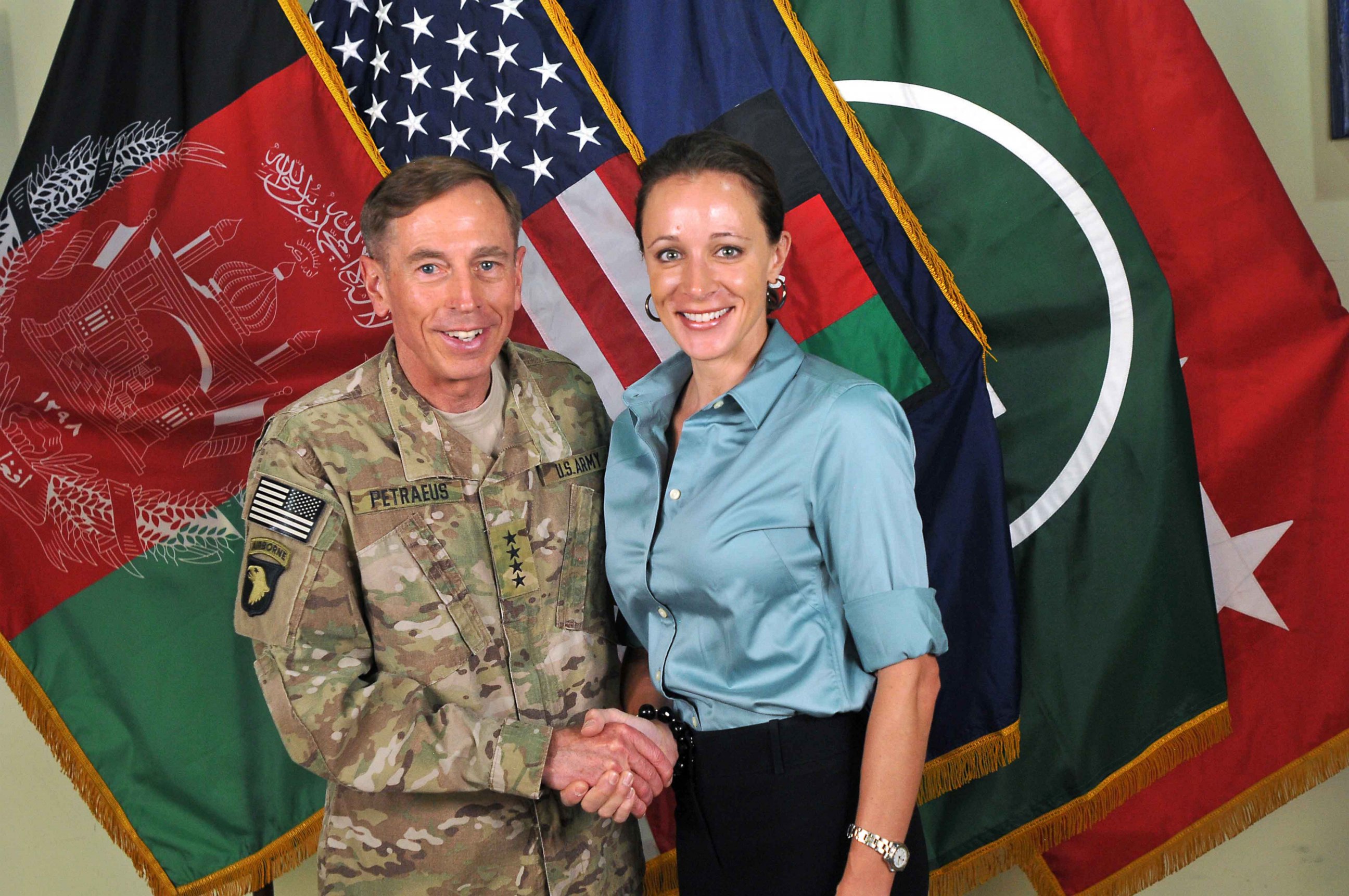 PHOTO: In this handout image provided by the International Security Assistance Force, former Commander of International Security Assistance Force and U.S. Forces-Afghanistan; CIA Director Gen. Davis Petraeus shakes hands with biographer Paula Broadwell.
