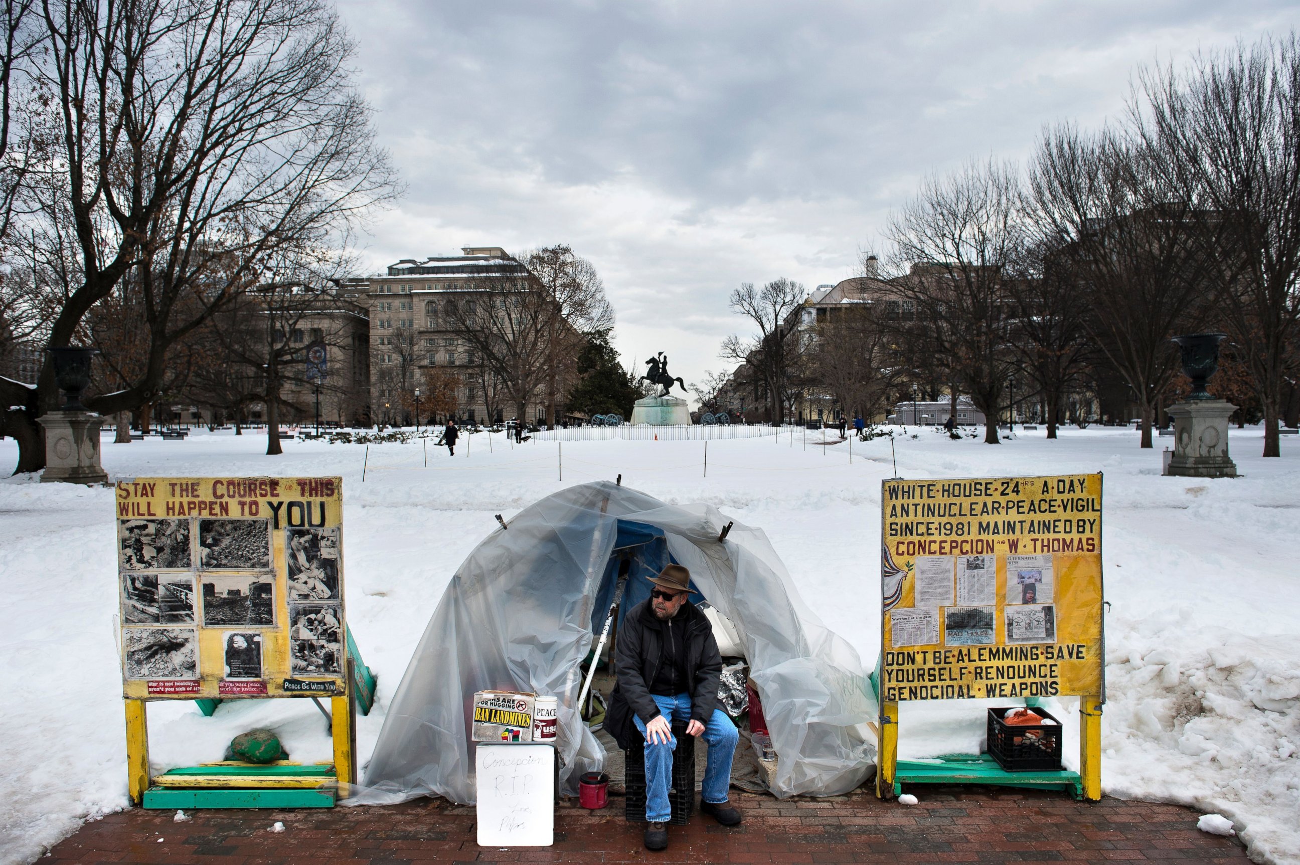 PHOTO: An activist sits at a protest sight in Lafayette Park across from the White House, Jan. 26, 2016 in Washington, DC.