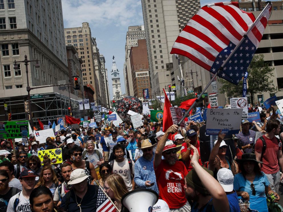 PHOTO: People march holding signs in support of former Democratic presidential candidate Bernie Sanders during a protest at the 2016 Democratic National Convention, July 25, 2016 in Philadelphia.