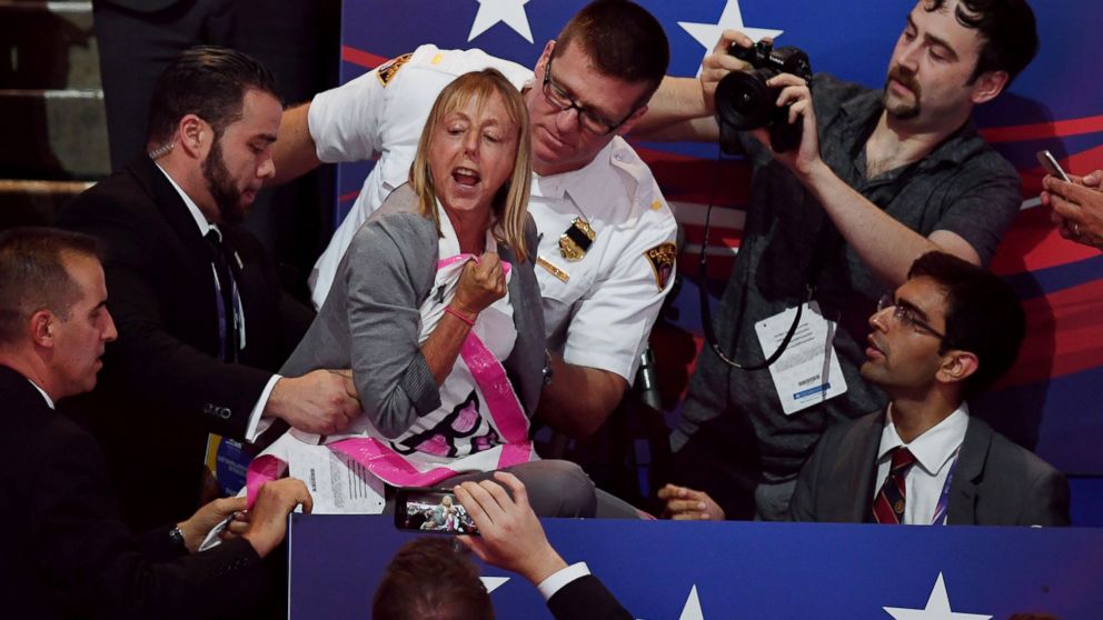 PHOTO: A CODEPINK protester is removed while Republican presidential candidate Donald Trump speaks on the last night of the Republican National Convention on July 21, 2016, in Cleveland.