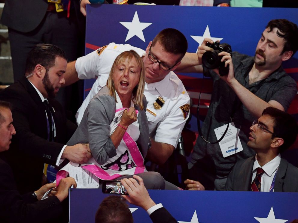 PHOTO: A CODEPINK protester is removed while Republican presidential candidate Donald Trump speaks on the last night of the Republican National Convention on July 21, 2016, in Cleveland.