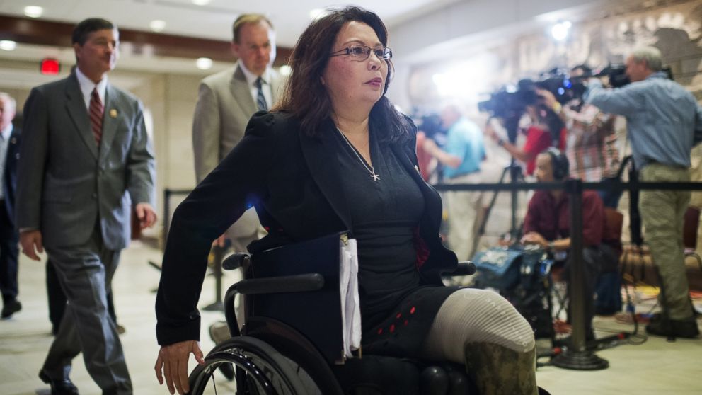 PHOTO: Rep. Tammy Duckworth, D-Ill., makes her way to a closed briefing in the Capitol Visitor Center for House members on the administration's strategy for combating ISIL, in this Sept. 11, 2014 file photo. 
