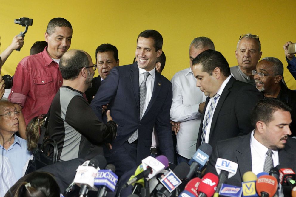 PHOTO: Venezuelan opposition leader Juan Guaido greets supporters during a press conference at the headquarters of political party Un Nuevo Tiempo on May 03, 2019, in Caracas, Venezuela.