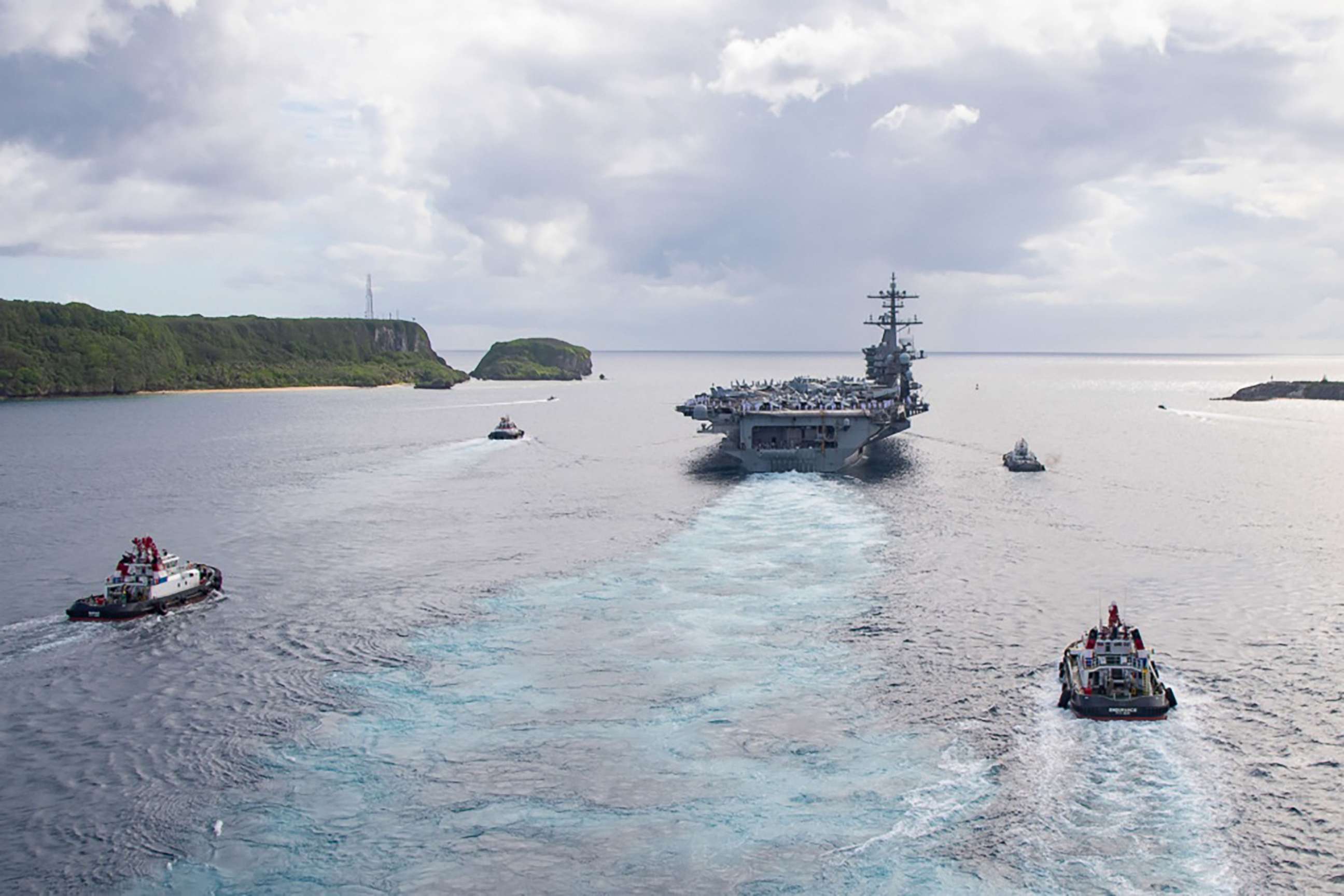 PHOTO: The aircraft carrier USS Theodore Roosevelt (CVN 71) departs Apra Harbor in Guam,  June 4, 2020, following an extended visit in the midst of the COVID-19 global pandemic.