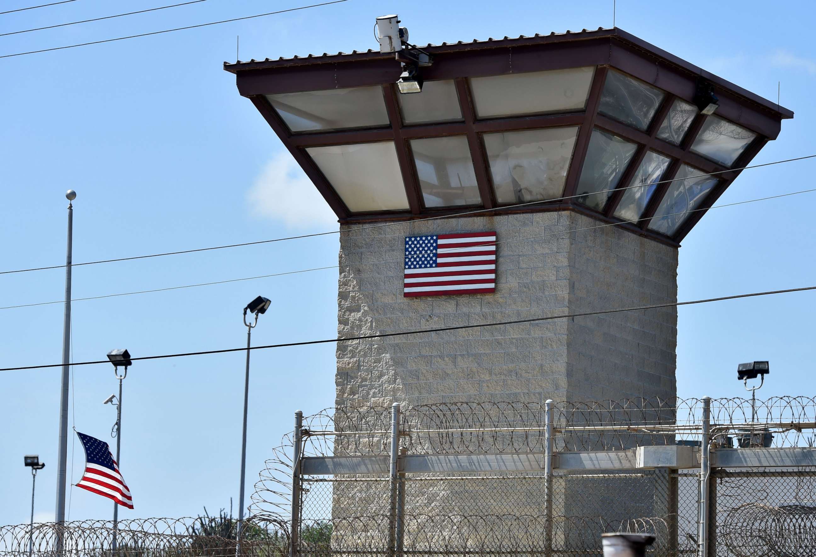 PHOTO: This file photo made during an escorted visit and reviewed by the U.S. military shows the razor wire-topped fence and the watch tower of "Camp 6" detention facility at the US Naval Station in Guantanamo Bay, Cuba, April 8, 2014.   

