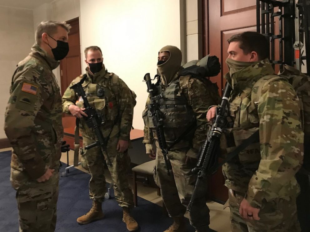 PHOTO: Gen. Daniel Hokanson, left, Chief of the National Guard Bureau, meets with guardsmen at the U.S. Capitol on Jan. 23, 2021.