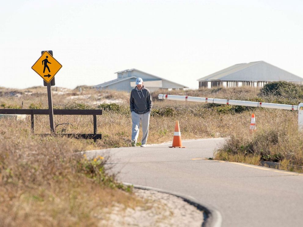 PHOTO: A man walks along the road at Gulf Islands National Seashore's Rosamond Johnson Beach in Perdido Key in Florida, Jan.11, 2019.