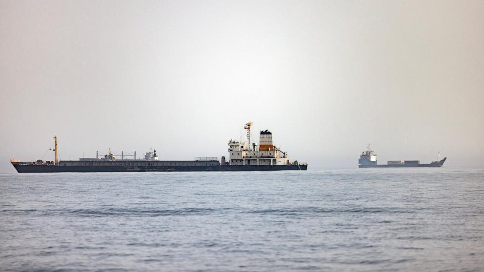 PHOTO: Cargo vessels remain anchored off Port Sultan Qaboos on June 20, 2026, in Muscat, Oman. 