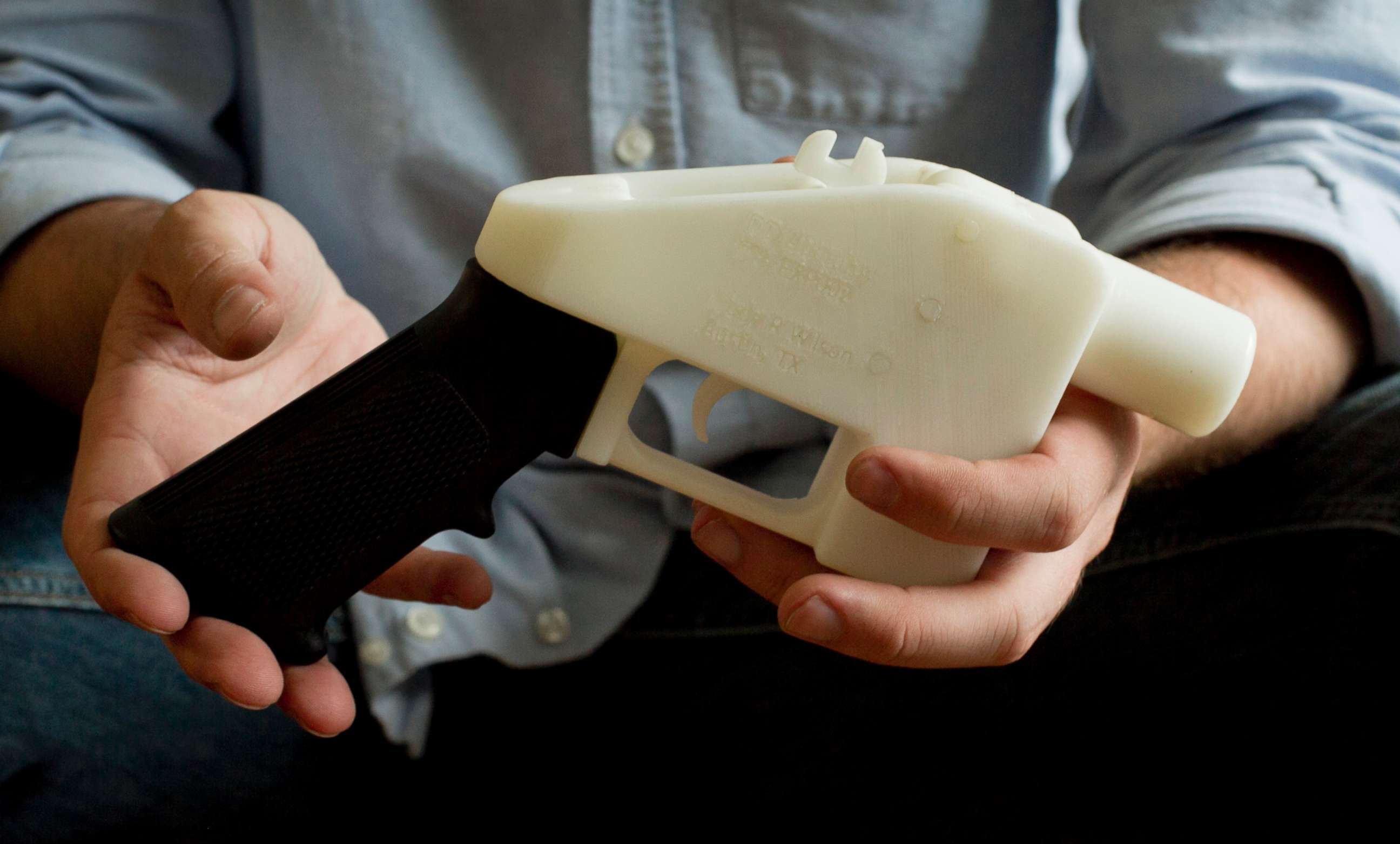 PHOTO: A man holds a gun created with a 3D printer in Austin, Texas, May 10, 2013.