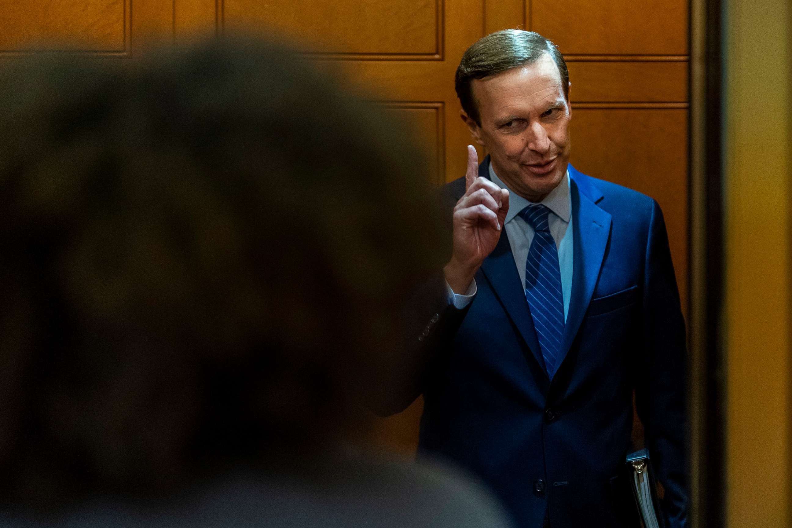 PHOTO: Sen. Chris Murphy speaks with reporters about ongoing negotiations regarding gun violence legislation in the Senate Subway on Capitol Hill, June 8, 2022.