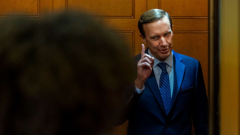 PHOTO: Sen. Chris Murphy speaks with reporters about ongoing negotiations regarding gun violence legislation in the Senate Subway on Capitol Hill, June 8, 2022.