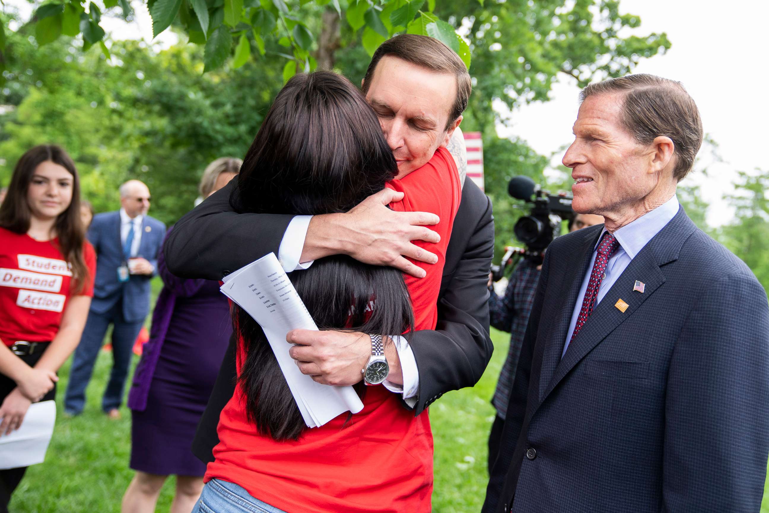 PHOTO: Sen. Chris Murphy hugs Erica Lafferty as Sen. Richard Blumenthal looks on during a rally to demand the Senate take action on gun safety in the wake of the Robb Elementary School shooting in Texas in Washington, May 26, 2022.