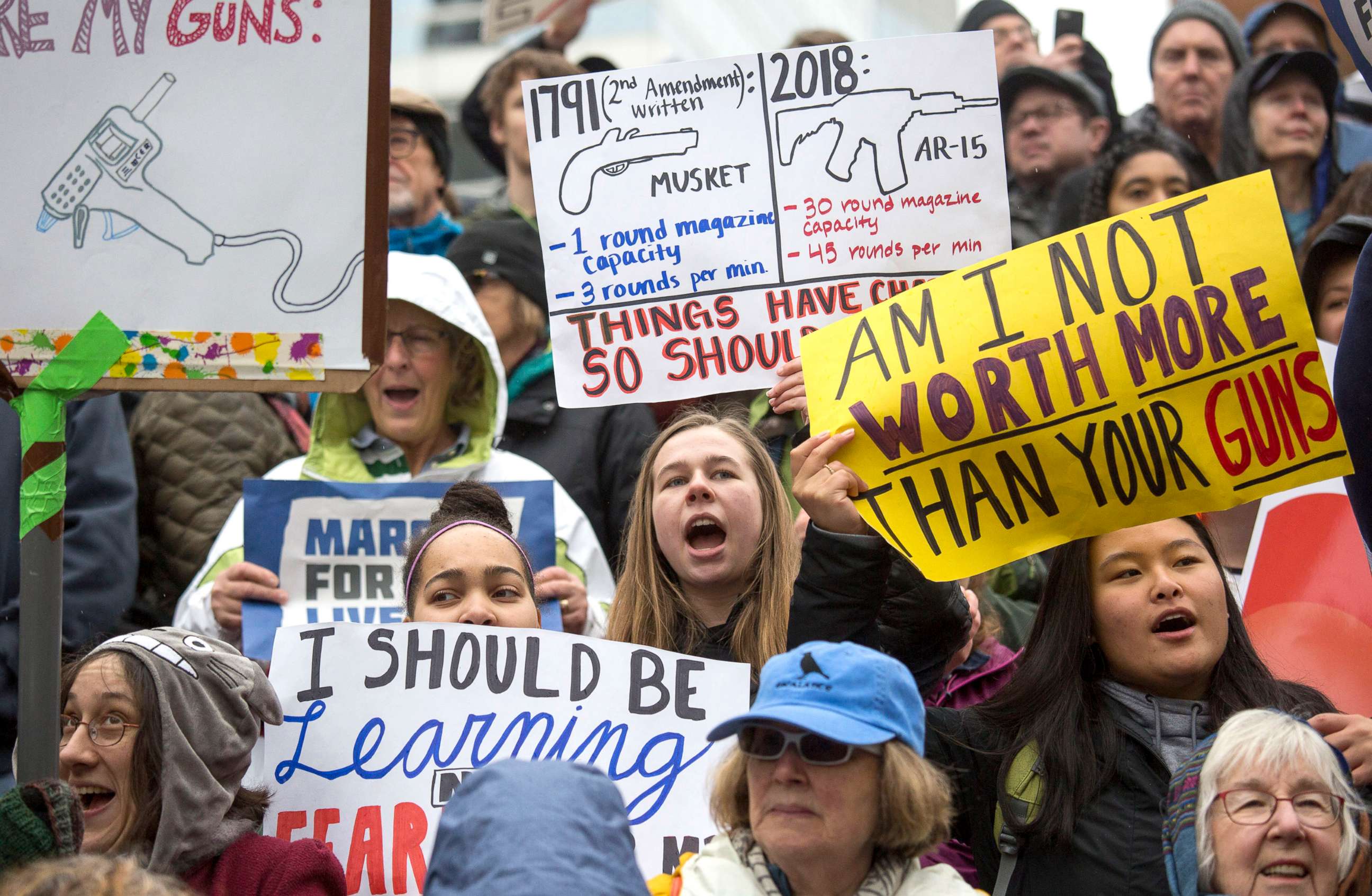 PHOTO: Protesters and students hold up signs as they take part in the March for Our Lives rally to call for legislative action to address school safety and gun violence, on March 24, 2018 in Portland, Ore.