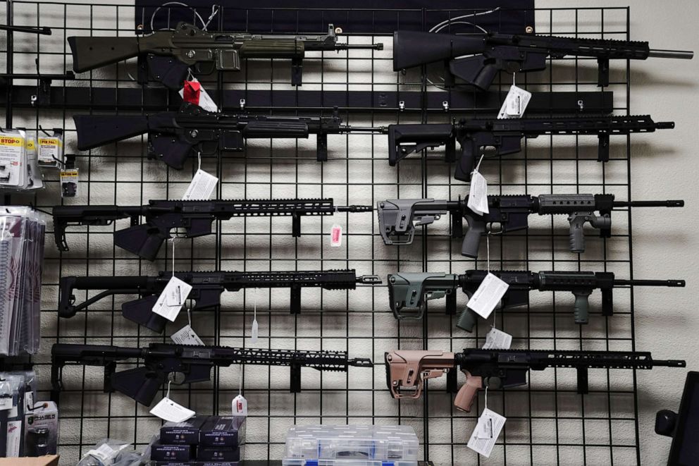 PHOTO: In this April 12, 2021, file photo, AR-15 style rifles are displayed for sale at a gun store in Oceanside, Calif.