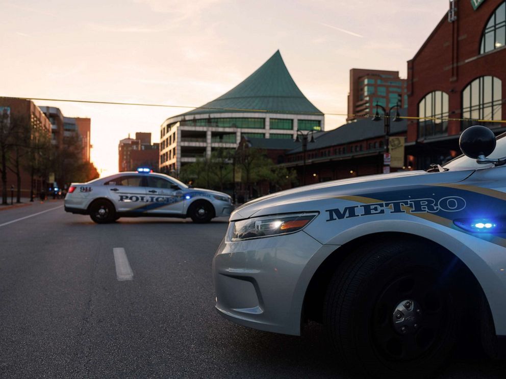 PHOTO: Police cars and cordon tape block Main Street near the Old National Bank after a mass shooting in Louisville, Ky. on April, 10, 2023.