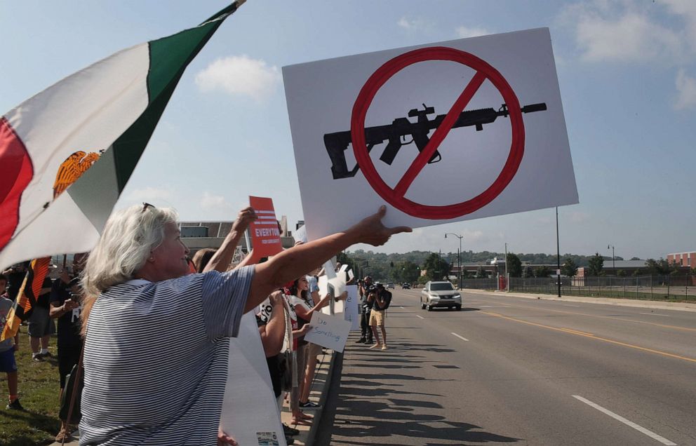 PHOTO: Demonstrators line the street near Miami Valley Hospital in anticipation of a visit from President Donald Trump on Aug. 07, 2019, in Dayton, Ohio.