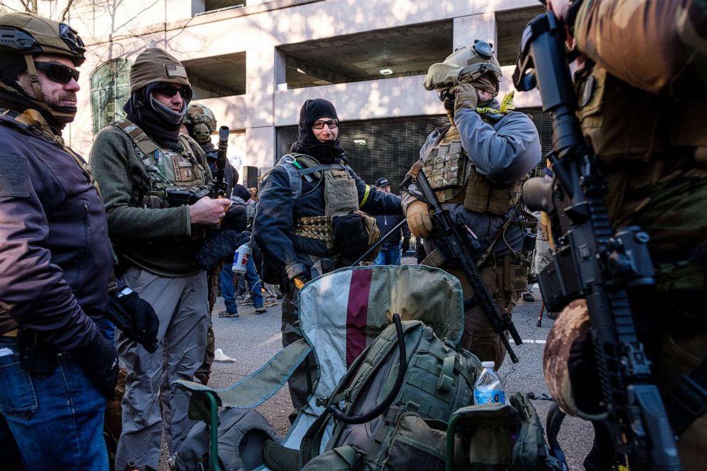 PHOTO: Demonstrators carrying riffles attend the Virginia Citizens Defense League (VCDL) Lobby Day rally at the state capitol in Richmond, Va., Jan. 20, 2020. 