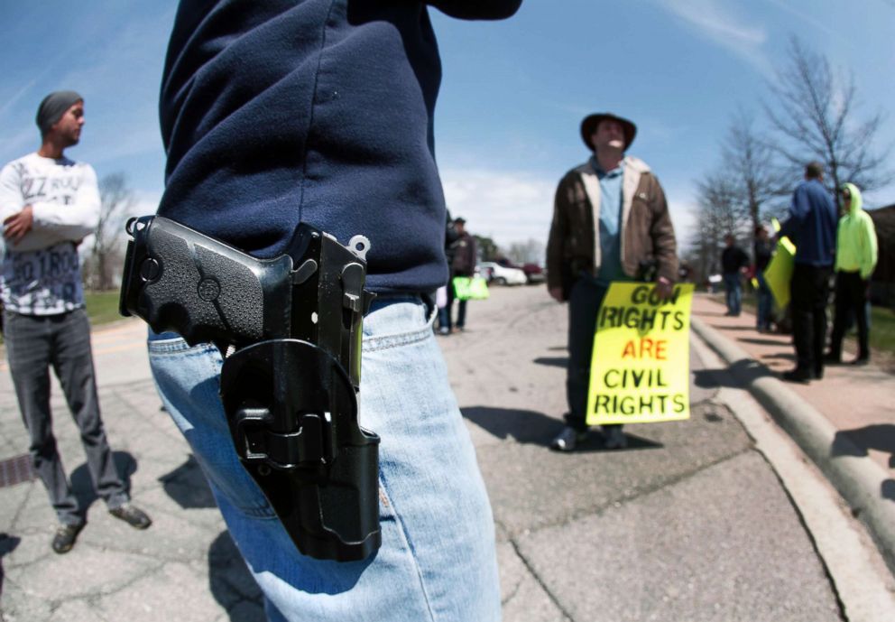 PHOTO: A supporter of Michigan's Open Carry law attends a rally and march, April 27, 2014, in Romulus, Mich.