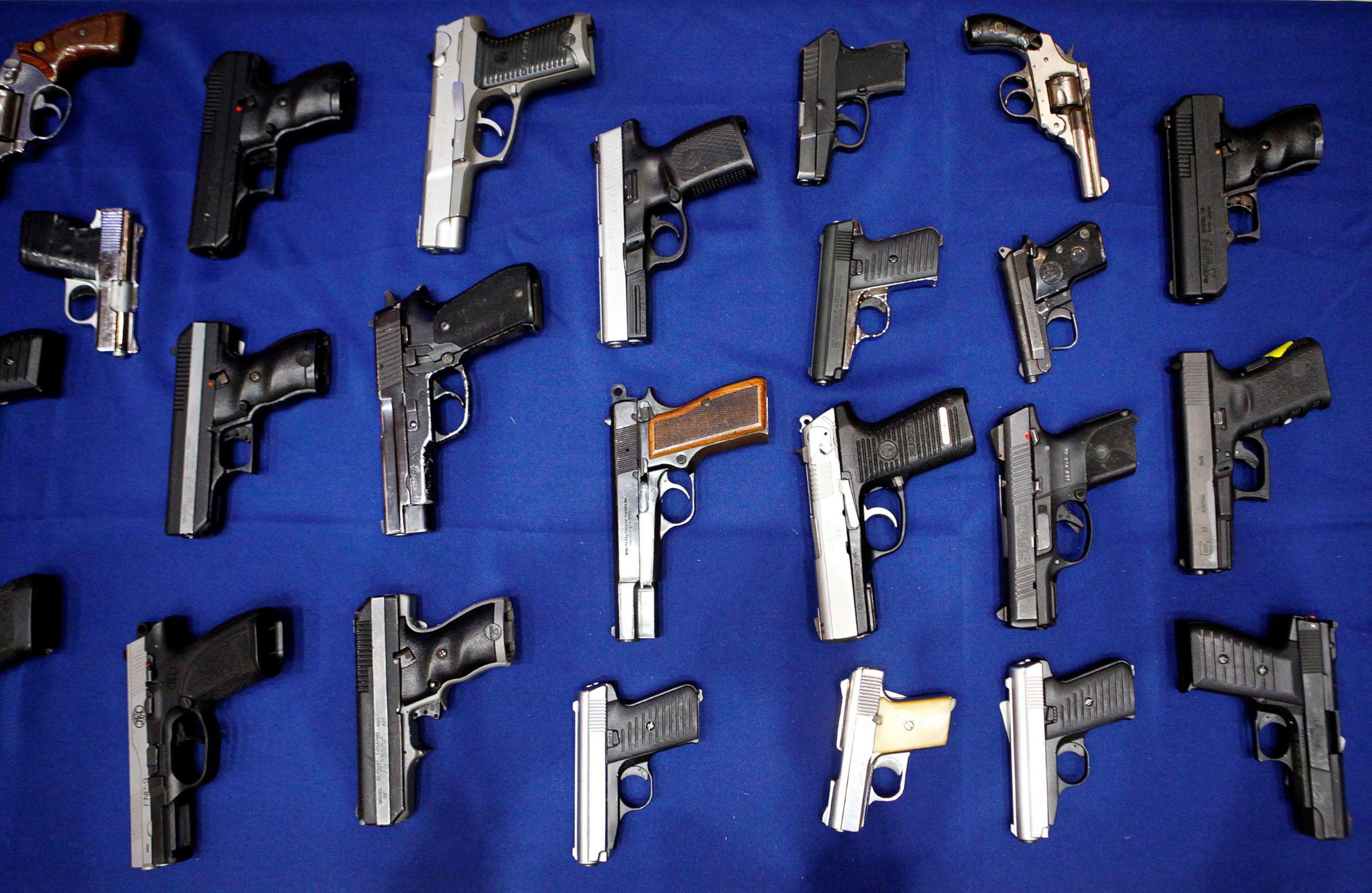 PHOTO: Seized handguns are pictured at the police headquarters in New York City, Aug. 19, 2013.