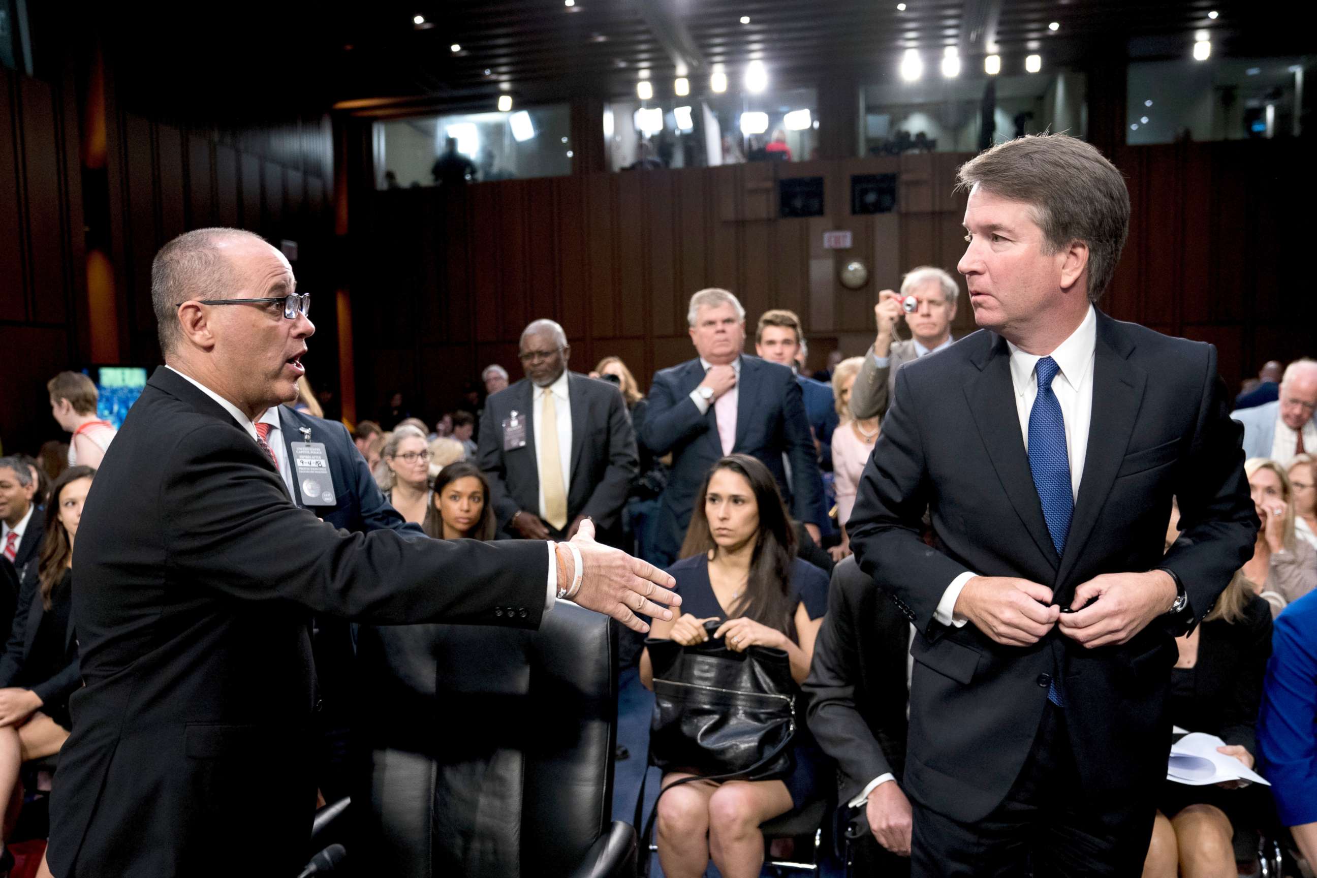 PHOTO: Fred Guttenberg, left, attempts to shake hands with President Donald Trump's Supreme Court nominee, Brett Kavanaugh as he leaves for a lunch break while appearing before the Senate Judiciary Committee on Capitol Hill in Washington, Sept. 4, 2018.