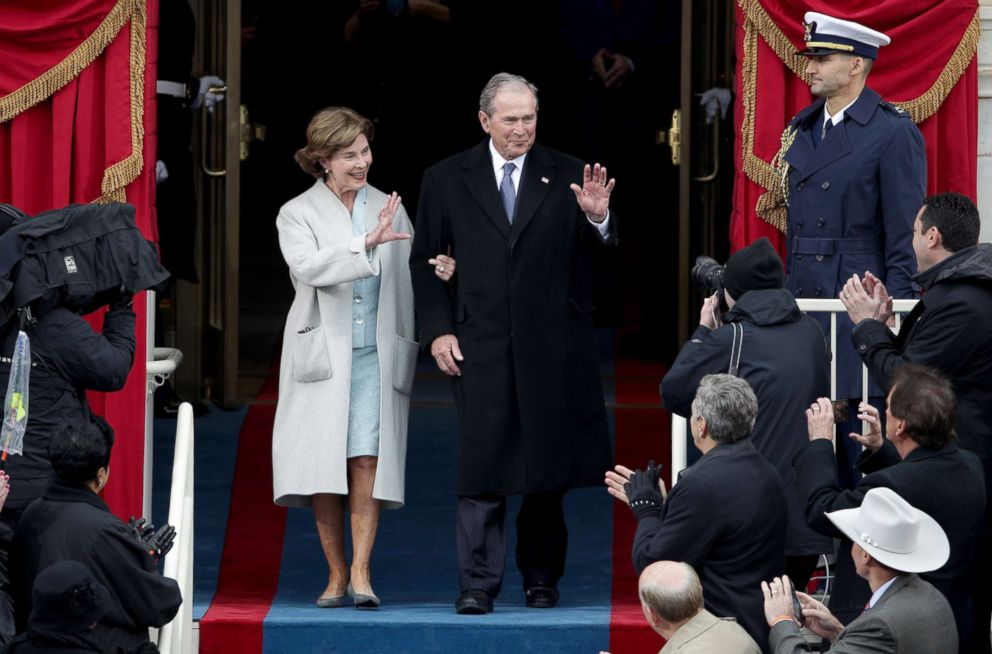 PHOTO: Former President George W. Bush and Laura Bush wave as they arrive for the inauguration of President Trump at the Capitol, Jan. 20, 2017 in Washington, D.C.