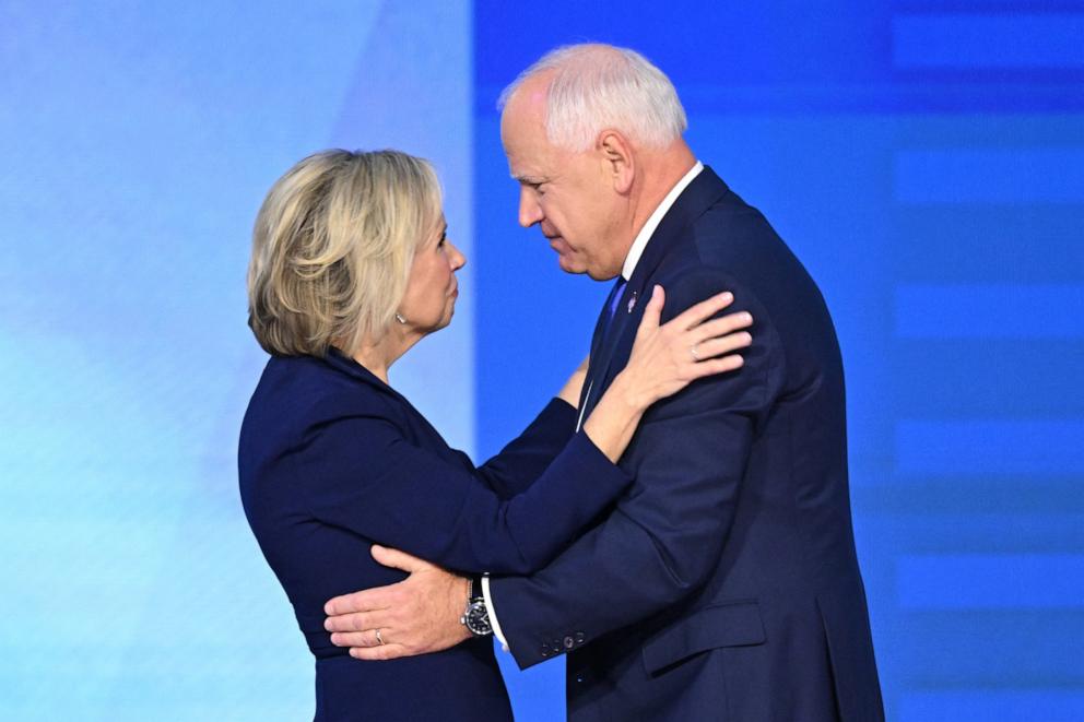 PHOTO: Minnesota Governor and Democratic vice presidential candidate Tim Walz is joined by his wife Gwen Walz after concluding his remarks on Day 3 of the Democratic National Convention in Chicago, on Aug. 21, 2024. 