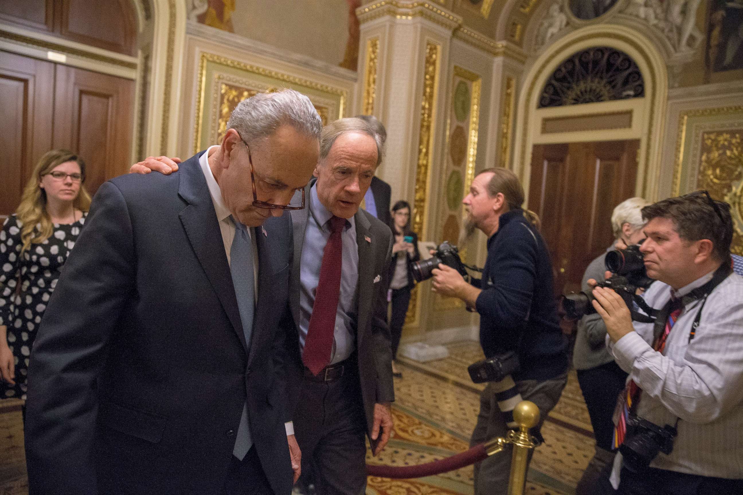PHOTO: WASHINGTON, DC - JANUARY 19:  (L-R) Senate Minority Leader Chuck Schumer (D-NY) and Senator Tom Carper (D-DE) walk out of a Democratic Caucus meeting at the US Capitol on January 19, 2018 in Washington, DC.