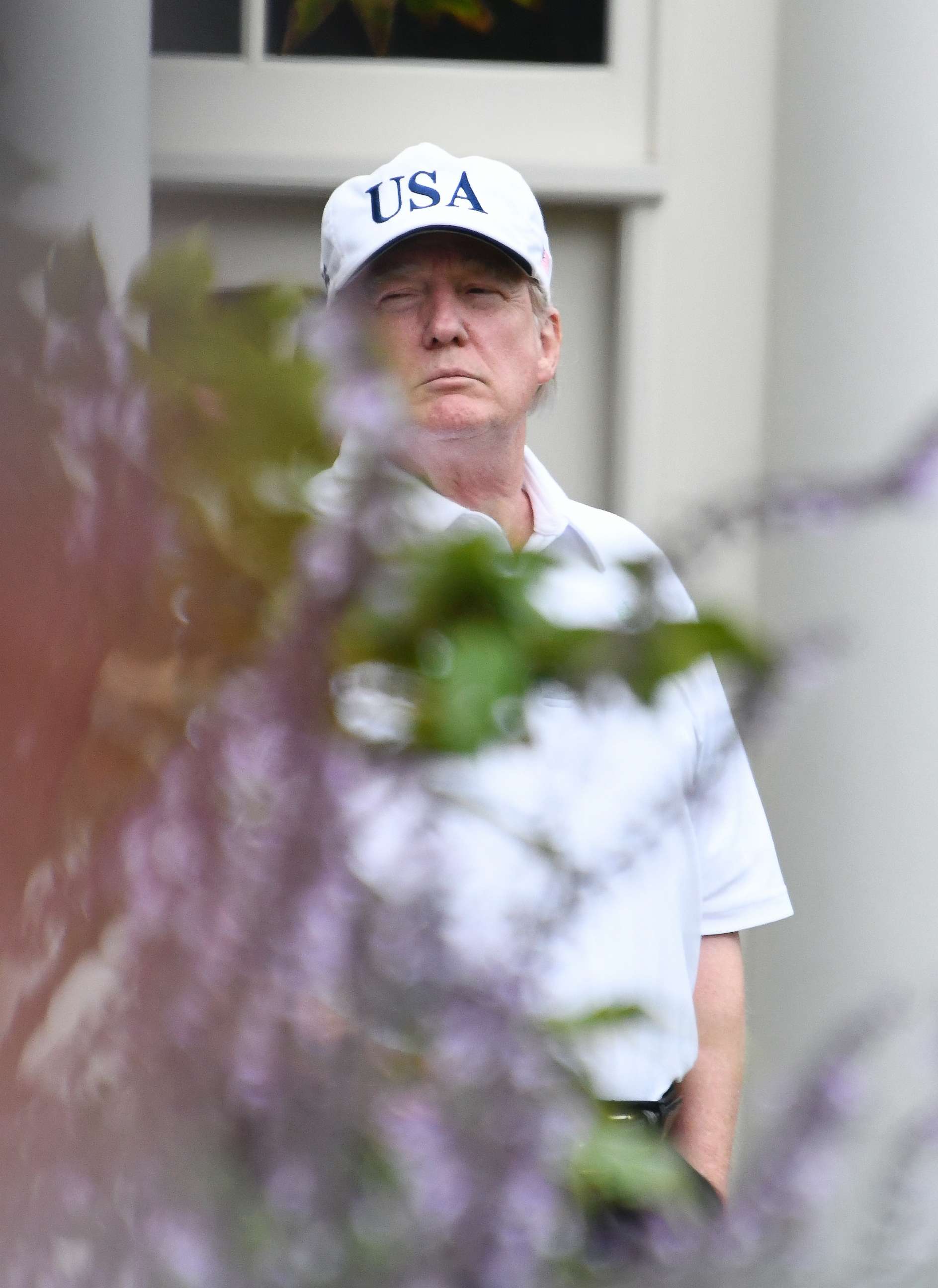 PHOTO: U.S. President Donald J. Trump stands in the First Lady's garden of the White House on October 14, 2017 in Washington, DC. Trump played a round of golf with Senator Lindsey Graham (R-SC) earlier in the day. 