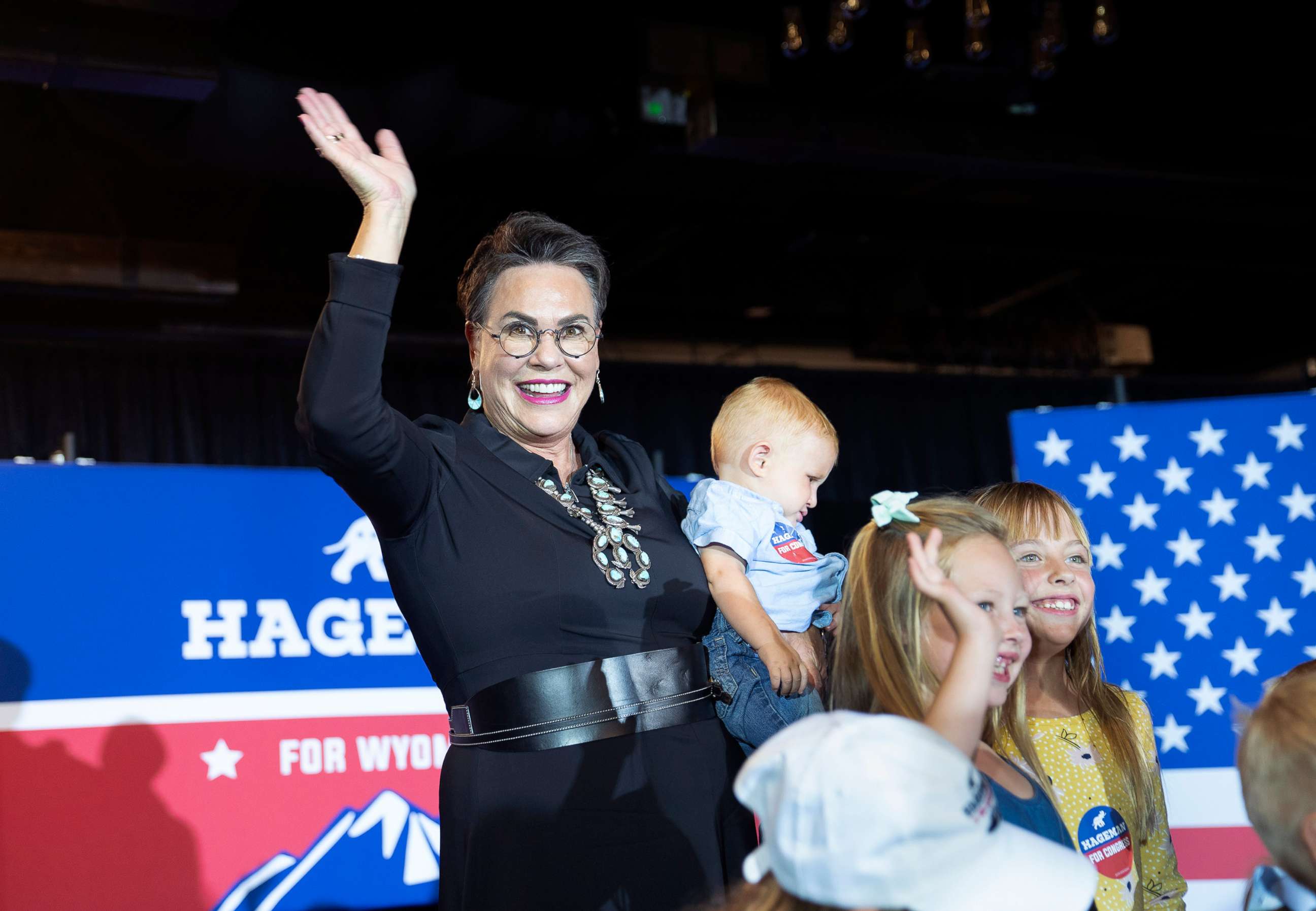 PHOTO: Wyoming Republican congressional candidate Harriet Hageman waves as she takes a picture with children during a primary election night party, Aug. 16, 2022, in Cheyenne, Wyo.