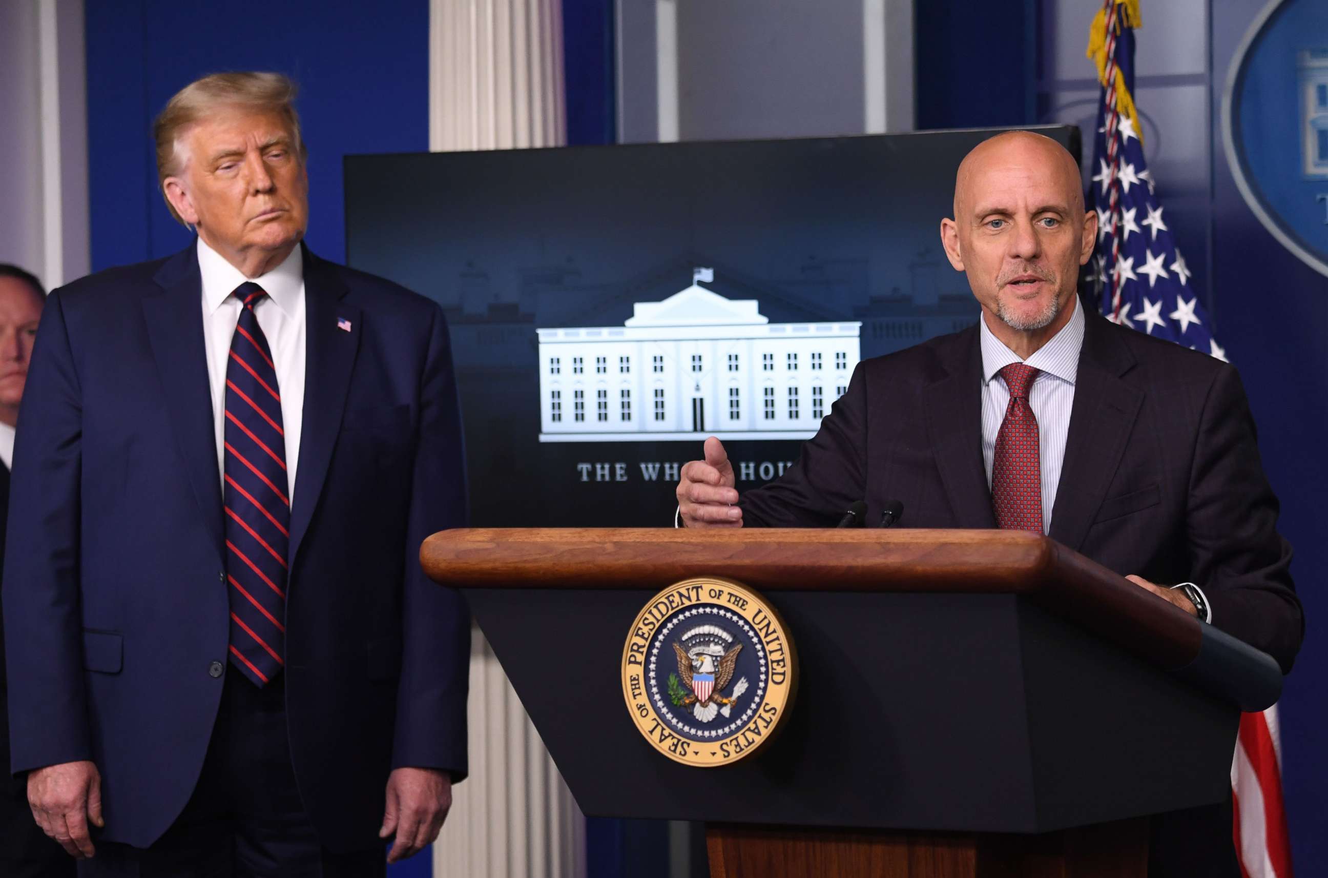 PHOTO: FDA Commissioner Stephen Hahn speaks as President Donald Trump looks on during a press conference at the White House, in Washington, Aug. 23, 2020.