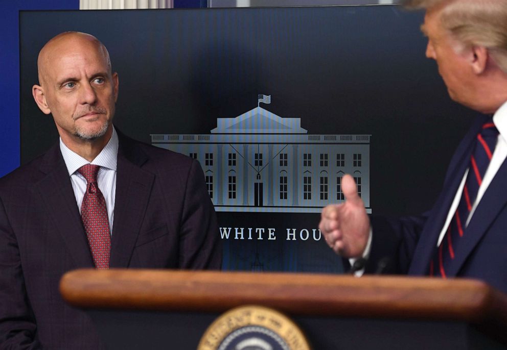 PHOTO: FDA Commissioner Stephen Hahn listens as President Donald Trump speaks during a press conference at the White House, Aug. 23, 2020. 