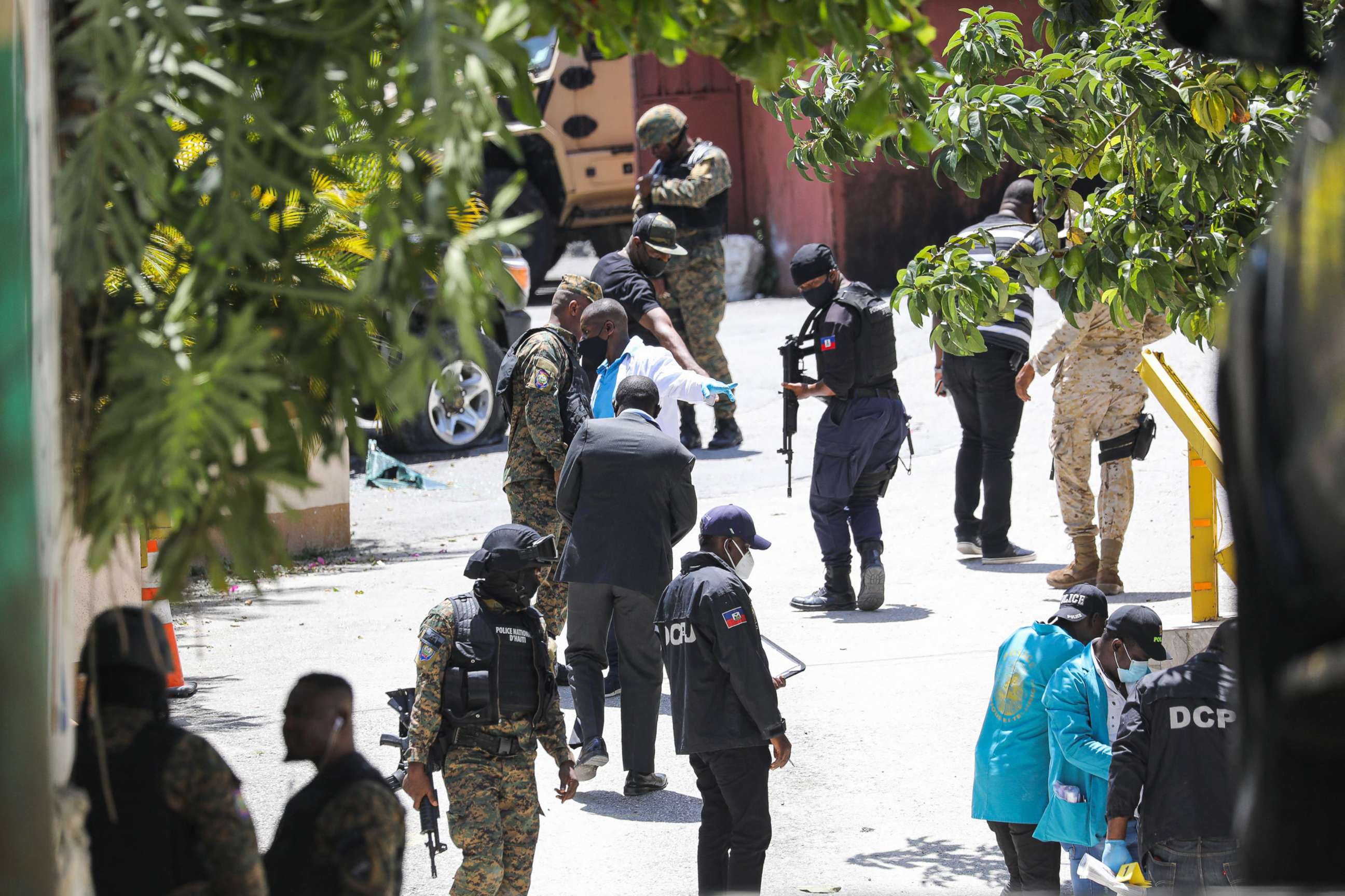 PHOTO: Members of the Haitian police and forensics look for evidence outside of the presidential residence, July 7, 2021, in Port-au-Prince, Haiti. 