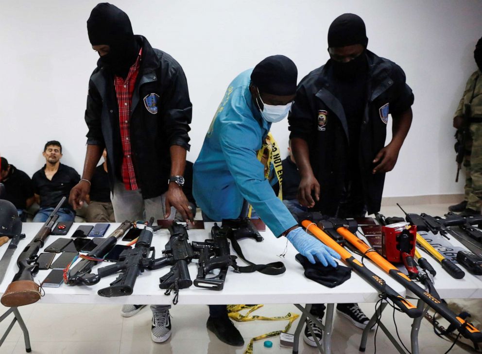 PHOTO: Weaponry, mobile phones, passports and other items are being shown to the media along with alleged suspects in the assassination of President Jovenel Moise, in Port-au-Prince, Haiti July 8, 2021.