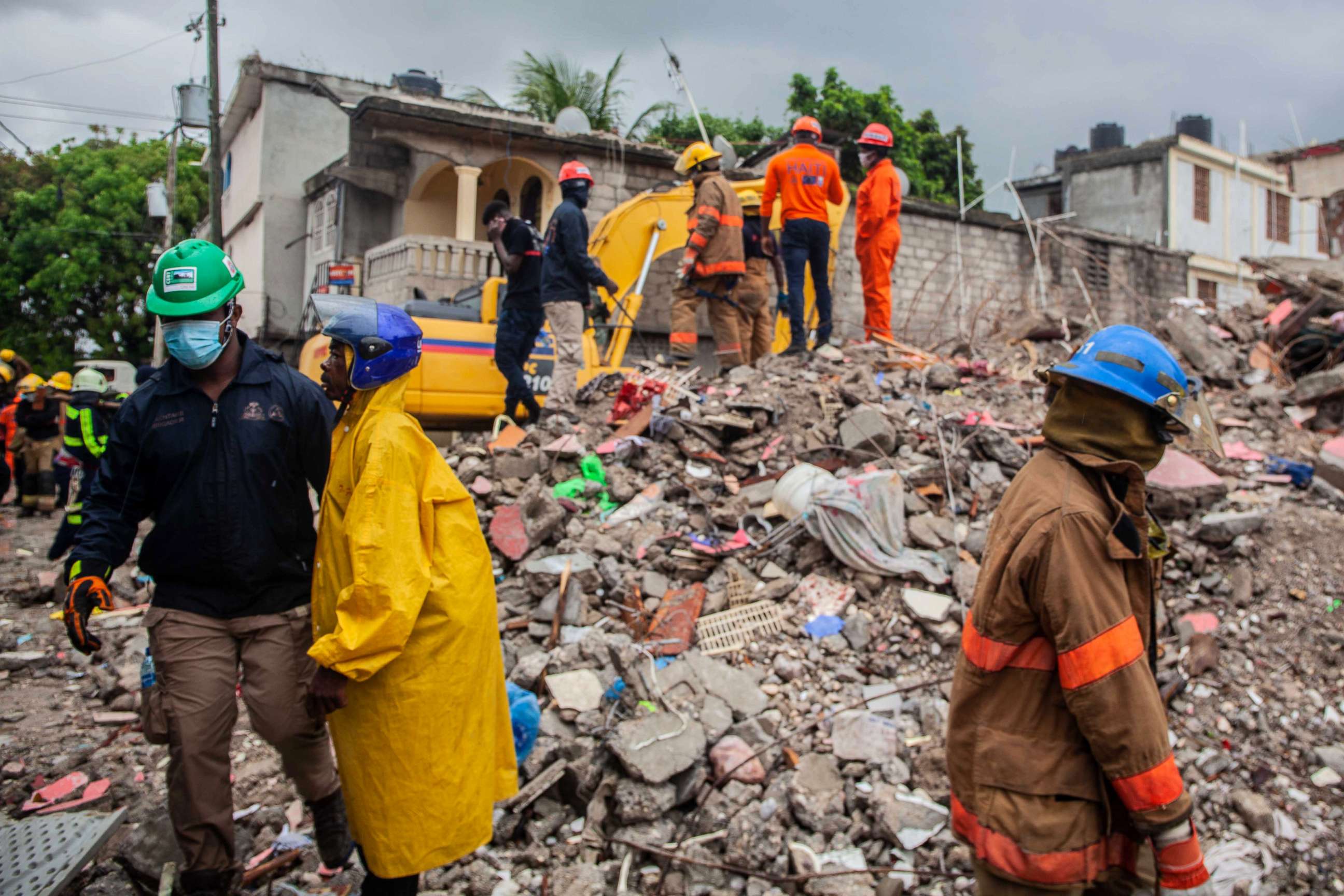 PHOTO: Firefighters remove debris in search of survivors after a 7.2-magnitude earthquake struck Haiti and as tropical storm Grace moves over Jamaica, Aug. 17, 2021, in Les Cayes, Haiti.