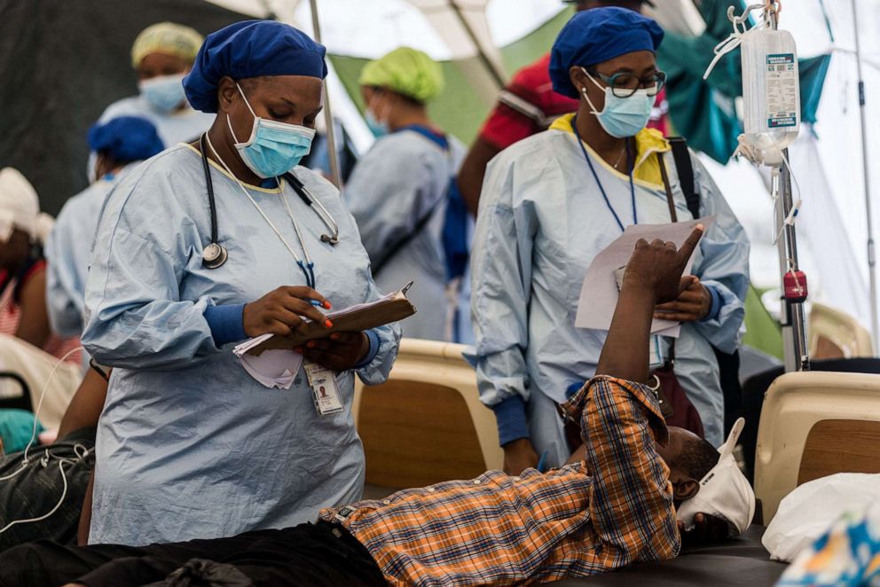PHOTO: Doctors examin an earthquake victim at Ofatma Hospital in Les Cayes, Haiti, Aug. 17, 2021.