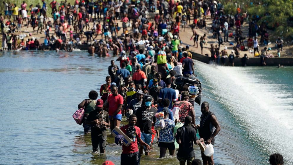 PHOTO: Haitian migrants use a dam to cross to and from the United States from Mexico, Sept. 17, 2021, in Del Rio, Texas.