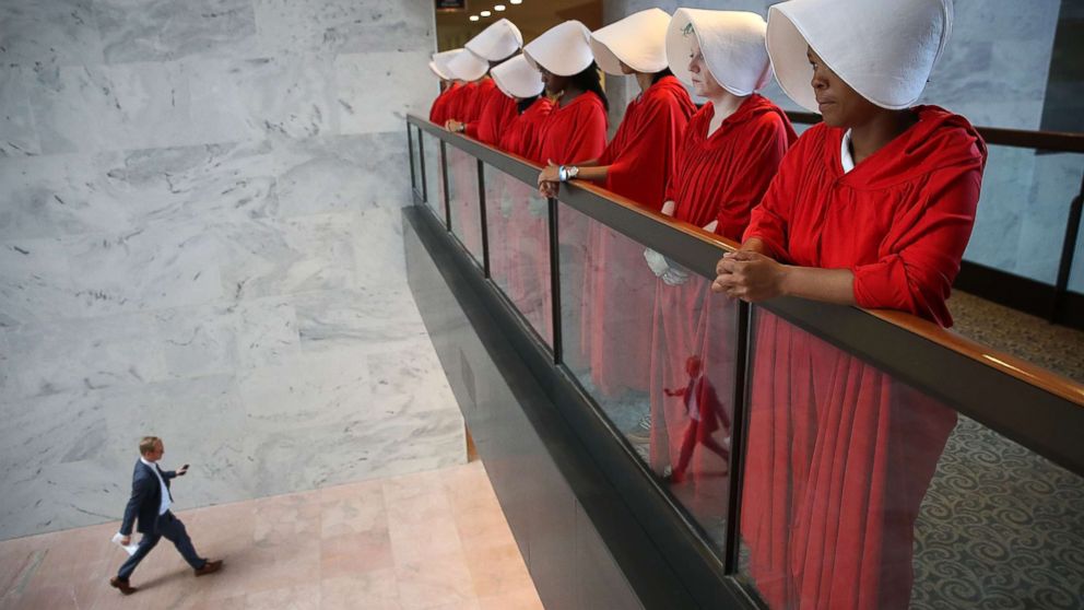 PHOTO: Protesters dressed in The Handmaid's Tale costume, protest outside the hearing room where Supreme Court nominee Judge Brett Kavanaugh will testify before the Senate Judiciary Committee on Capitol Hill, Sept. 4, 2018, in Washington, DC.
