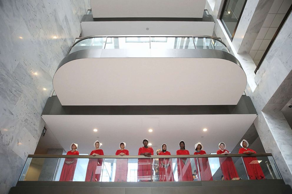 PHOTO: Protesters dressed in The Handmaid's Tale costume, protest outside the hearing room where Supreme Court nominee Judge Brett Kavanaugh will testify before the Senate Judiciary Committee on Capitol Hill, Sept. 4, 2018, in Washington, DC.