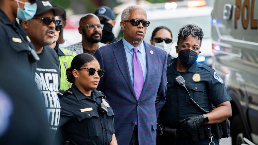PHOTO: Rep. Hank Johnson and Cliff Albright, second from left, co-founder of Black Voters Matter, are arrested during a protest to support voting rights outside of Hart Building in Washington, July 22, 2021.